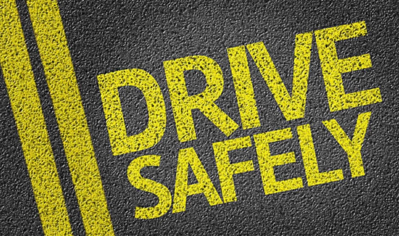 Safe driving text on road